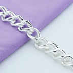 Silver-plated alloy bracelet worn on wrist