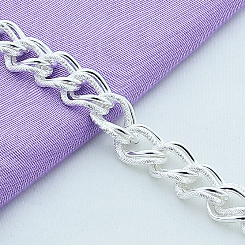 Silver-plated alloy bracelet worn on wrist