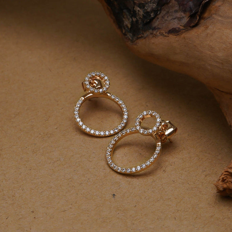 Micro pave zirconia circle stud earrings, front view