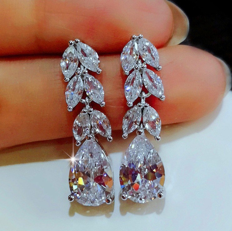 Silver big hoop earrings for women, worn close-up