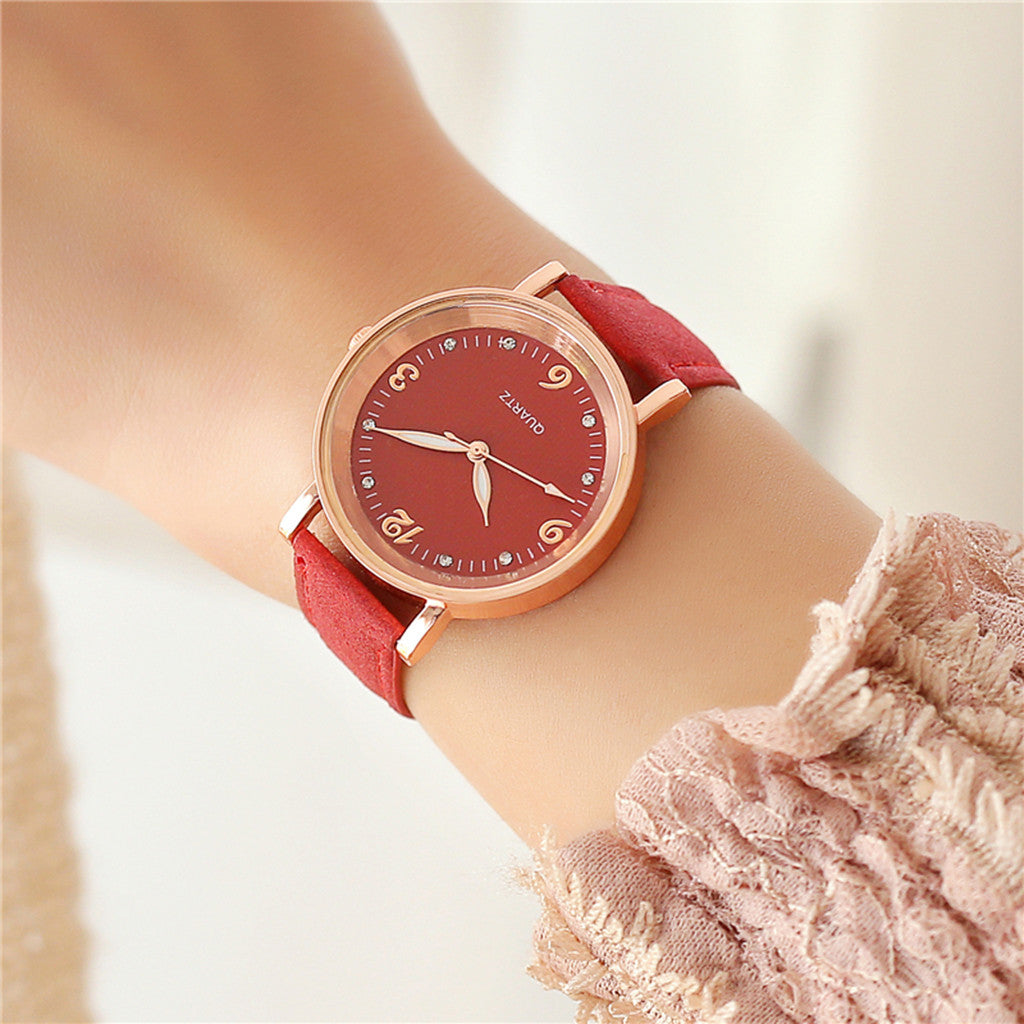 Luminous quartz watch worn on wrist