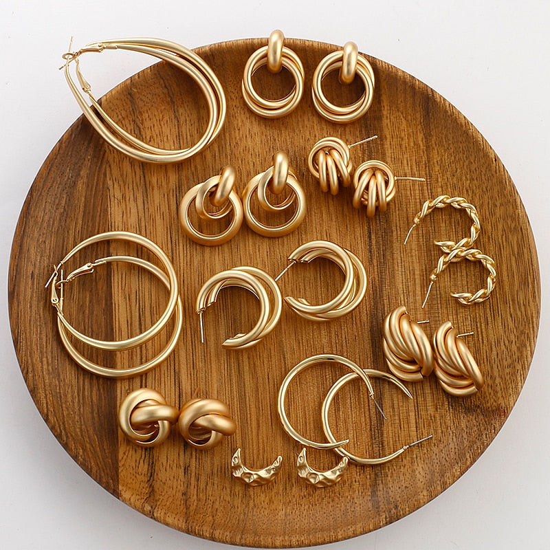 Sweet pearl and alloy geometric earring set, front view