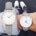 Women's large dial leather quartz watch, ellipse case front view