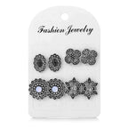Retro diamond and flower earring set, close-up detail