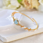 Gold-plated pearl bracelet worn on wrist