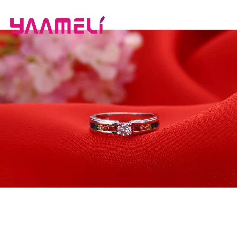 Silver rainbow cubic zircon ring worn on hand