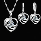 Silver heart necklace and matching earrings, close-up