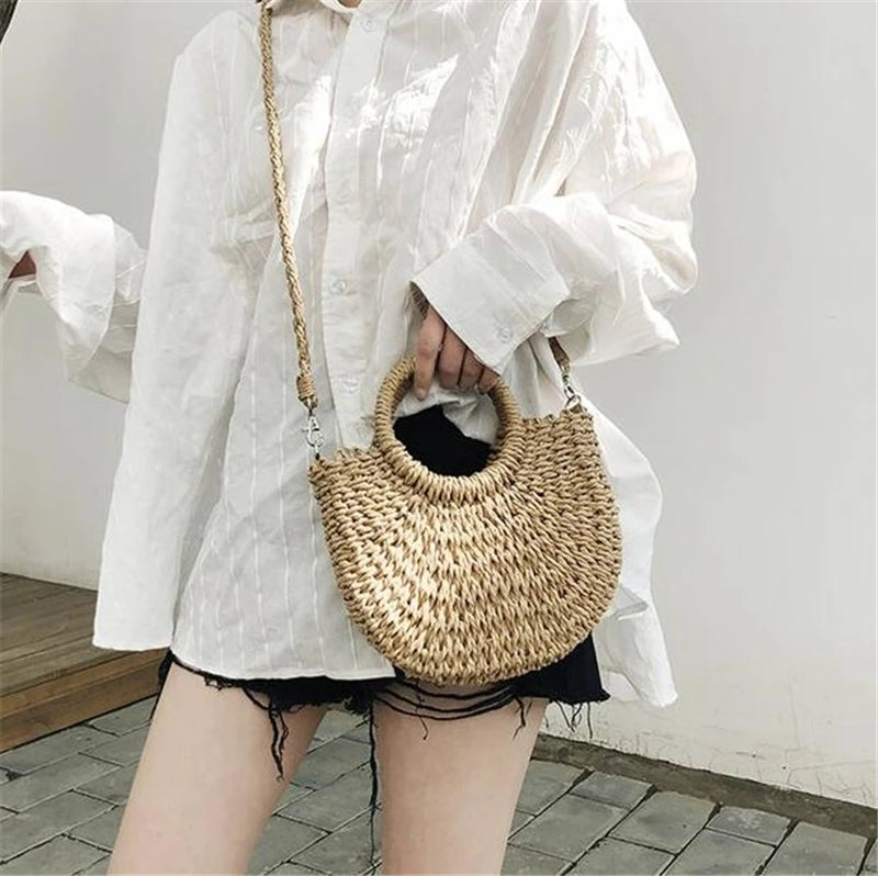 Handmade half-round rattan straw bag with woven design, crossbody style, ideal for summer beach and casual outings.