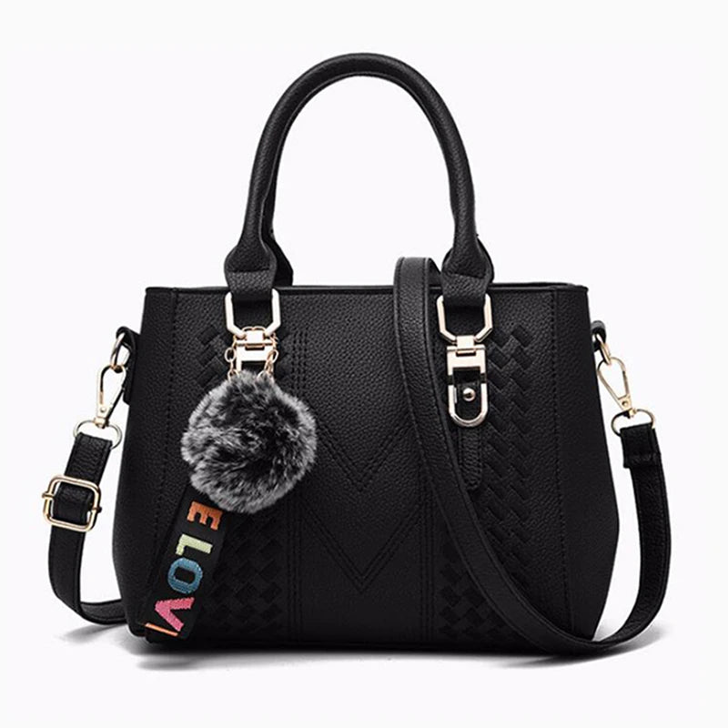 Leather embroidery messenger bag for women with hand strap, stylish ladies' handbag featuring intricate embroidery and compact design.