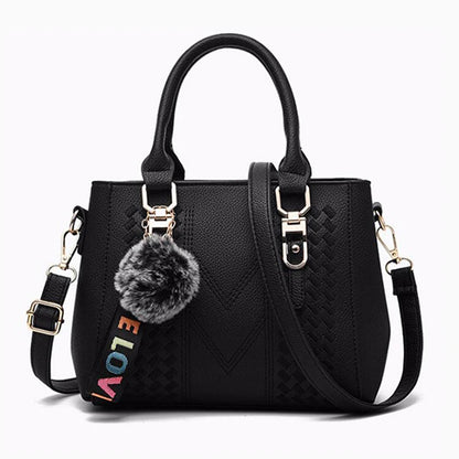 Leather embroidery messenger bag for women with hand strap, stylish ladies' handbag featuring intricate embroidery and compact design.