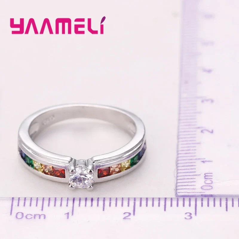 Silver rainbow zircon wedding ring, packaging shot