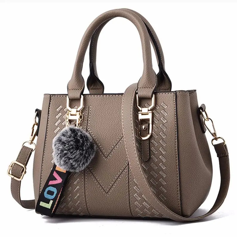 Leather embroidery messenger bag for women with hand strap, stylish ladies' handbag from Prime Deal Zone, featuring detailed embroidery design.