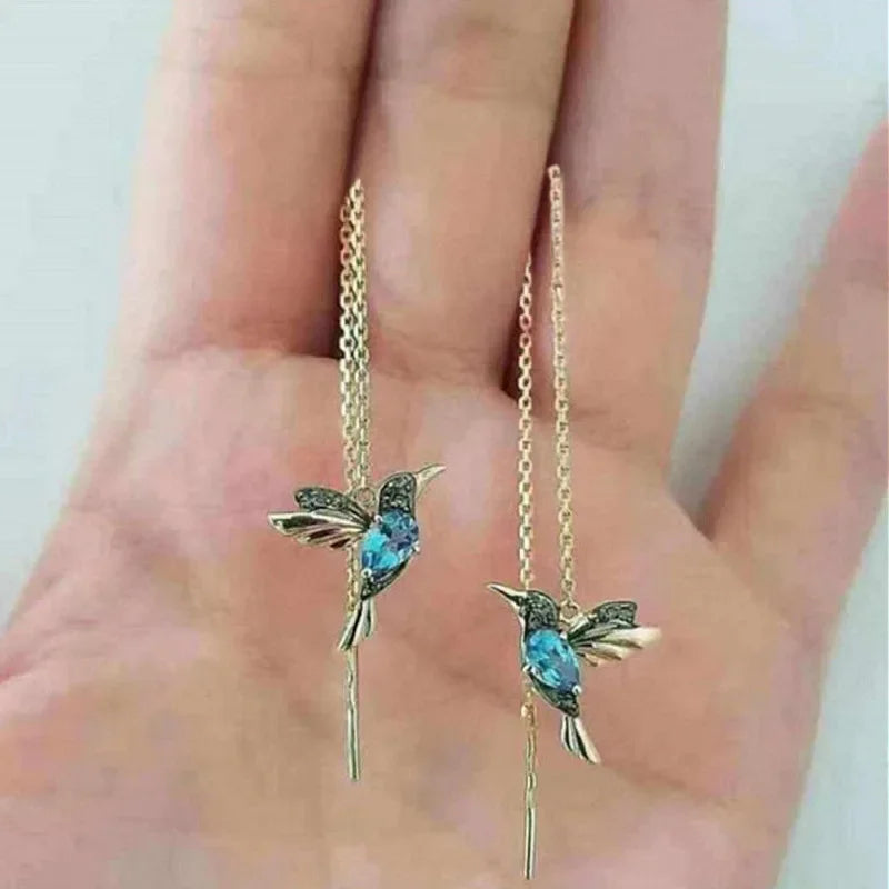 Hand-carved bird-shaped long tassel earrings for women, featuring red and green synthetic zircon, elegant banquet jewelry design.