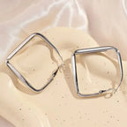 Gold square hoop earrings for women featuring exaggerated geometric irregular circle design by Prime Deal Zone.