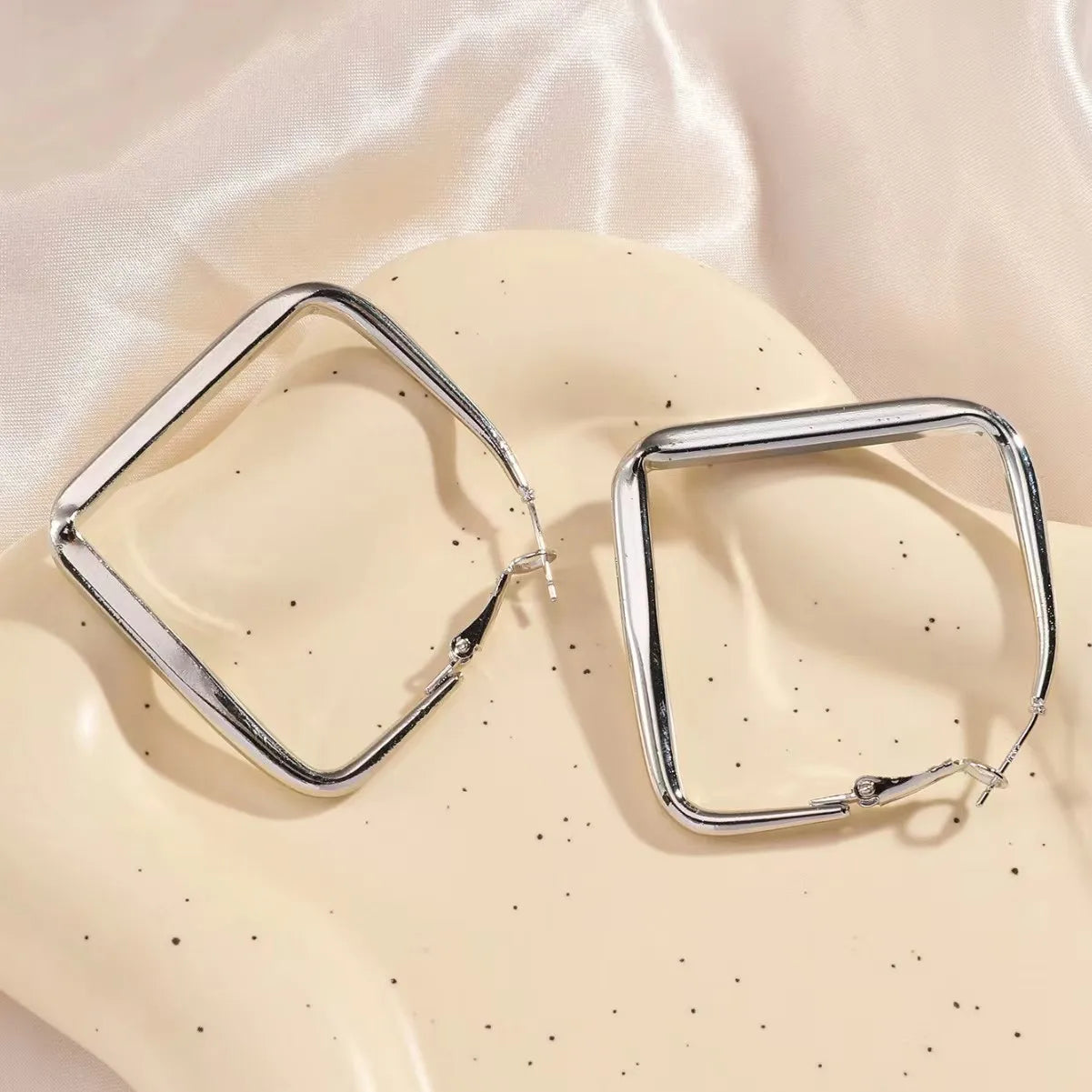Gold square hoop earrings for women featuring exaggerated geometric irregular circle design by Prime Deal Zone.