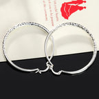 3cm circle hoop earrings worn close-up
