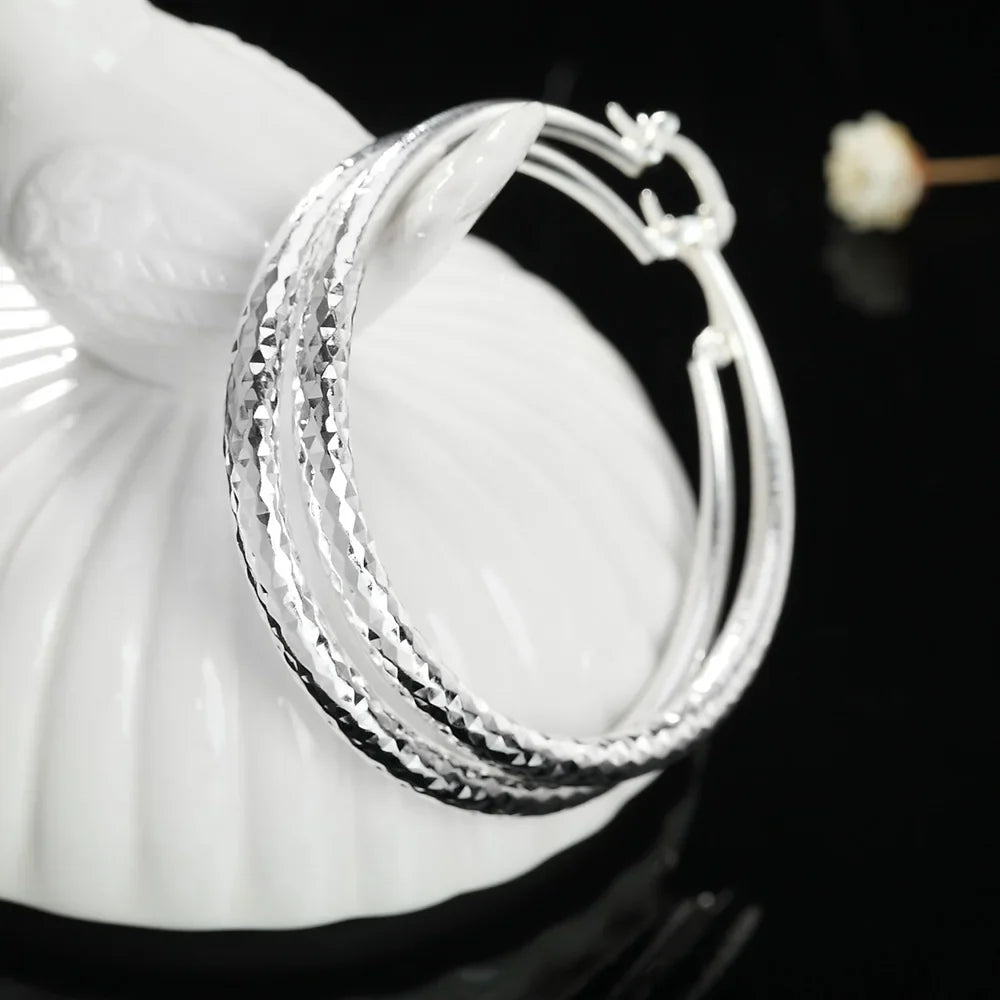 3cm circle hoop earrings styled with everyday outfit