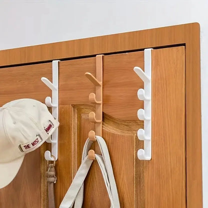Plastic over-the-door hanging rack with hooks for purses and bags, ideal for bedroom storage and organization.