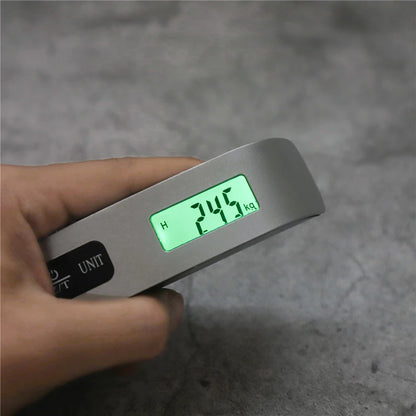 Digital portable luggage scale with LCD display showing 50kg weight, ideal for travel and baggage weight measurement.