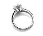 Six-claw solitaire ring close-up on finger