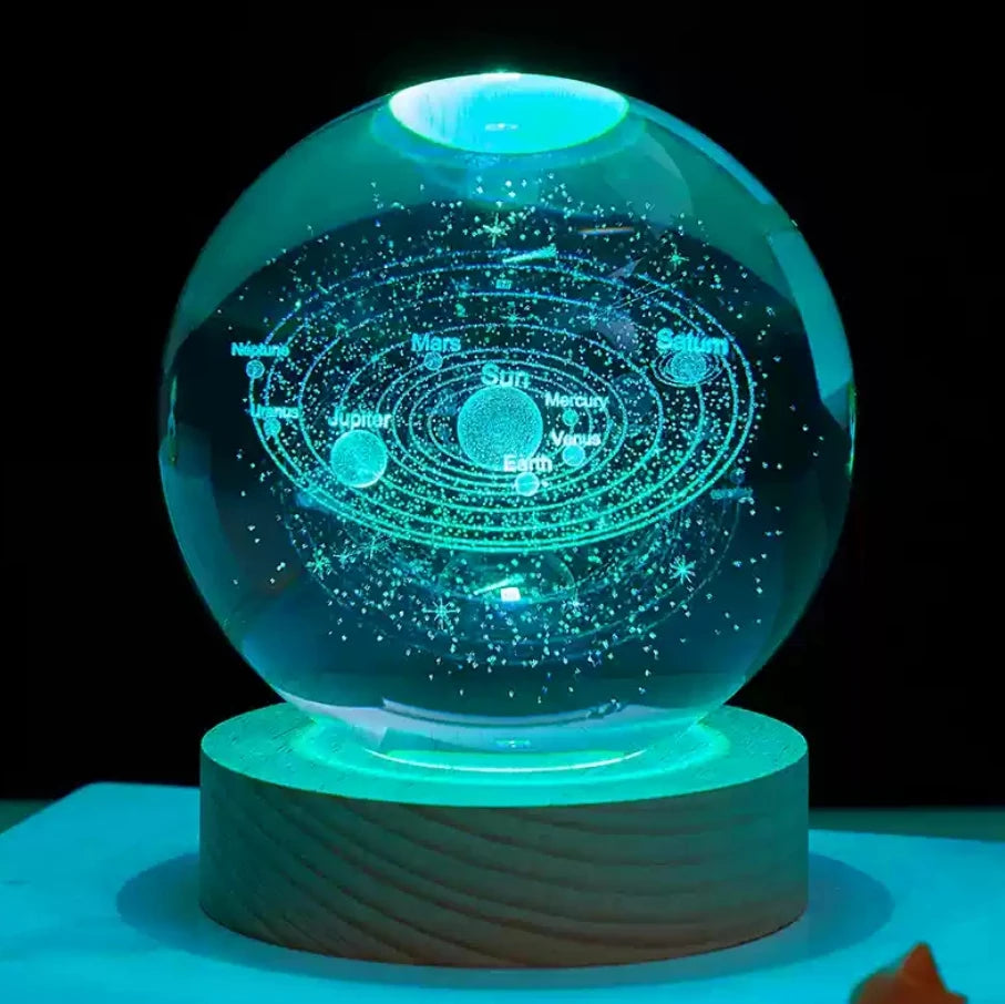 Glass crystal ball featuring 3D Saturn, planets, and moons, perfect for home decor and planetary-themed ornaments.