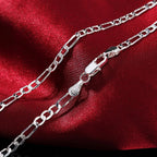 Silver 4mm chain bracelet worn on wrist
