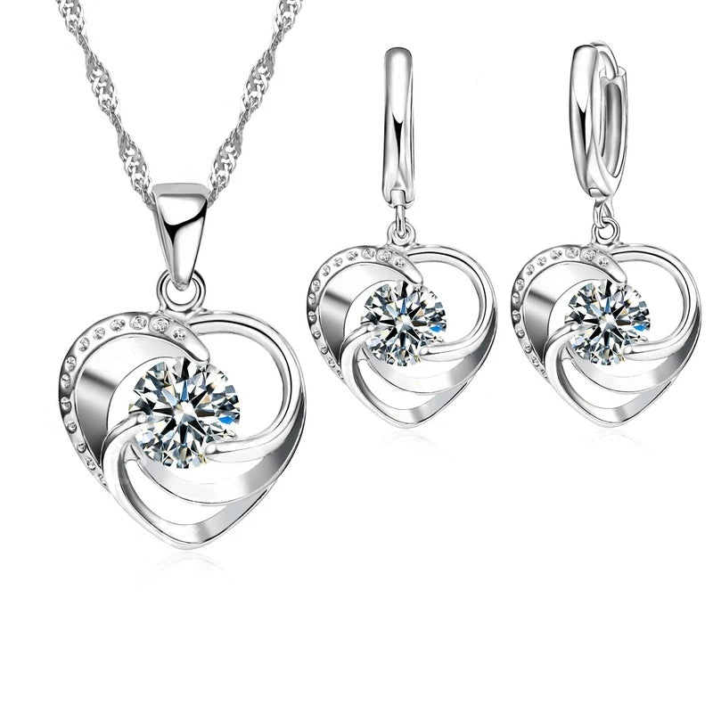 Silver heart necklace and earrings set, front view