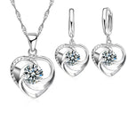 Silver heart necklace and earrings set, front view