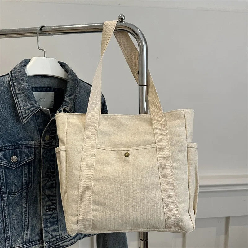 Large-capacity canvas shoulder bag by Prime Deal Zone, versatile for students' classes and daily use, with a durable cloth design.