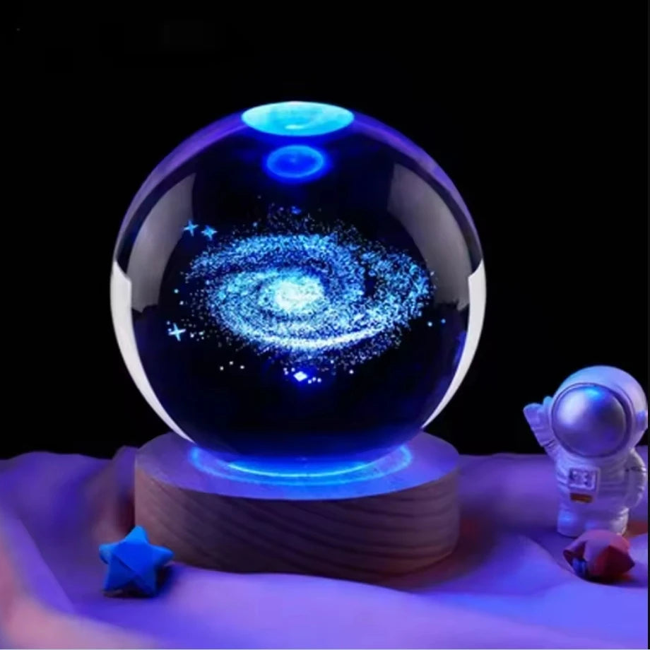 Glass crystal ball featuring a 3D Saturn solar system design, ideal for home decor and planetary-themed ornaments.