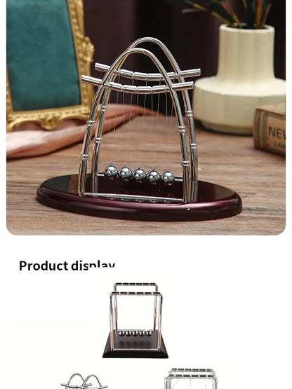 Prime Deal Zone Newton's Cradle steel ball set showing five interconnected pendulum balls on a desktop physics science toy