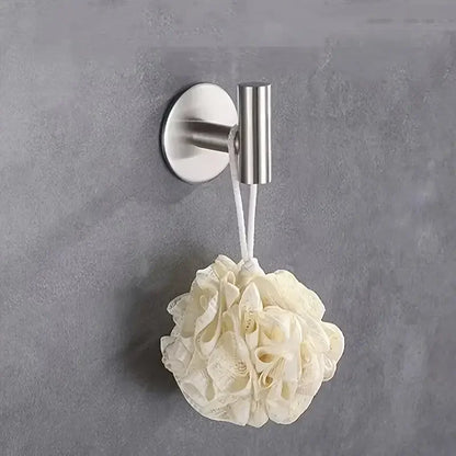 Stainless steel non-perforated bathrobe hook by Prime Deal Zone, mounted on wall, holding towels and clothes in bathroom or kitchen.