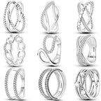 Silver zircon star and X-shaped rings, front view