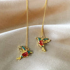 Hand carved bird-shaped long tassel earrings for women featuring red and green synthetic zircon, elegant banquet jewelry by Prime Deal Zone
