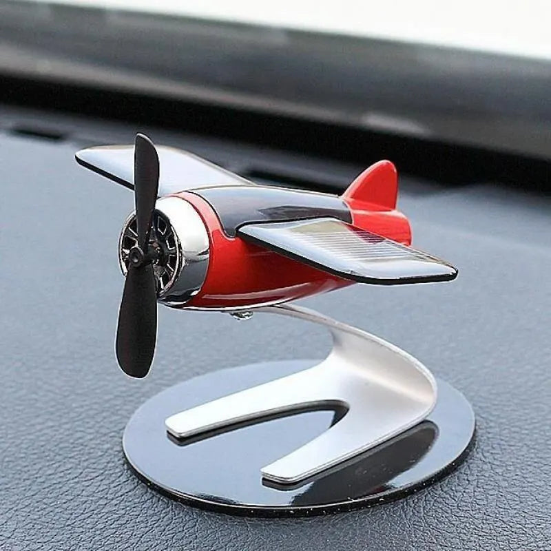 Creative solar-powered airplane desktop ornament for car interior decoration, ideal for men, women, and car enthusiasts.