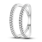 Silver zircon star ring worn on multiple fingers