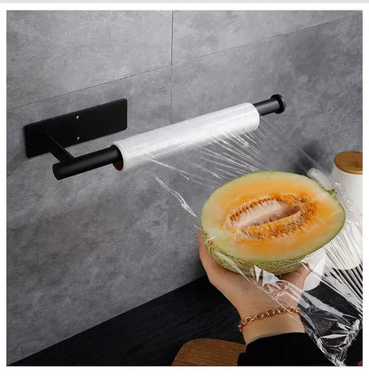 Prime Deal Zone adhesive kitchen paper towel holder with tissue hanger and toilet roll dispenser mounted on a bathroom cabinet.
