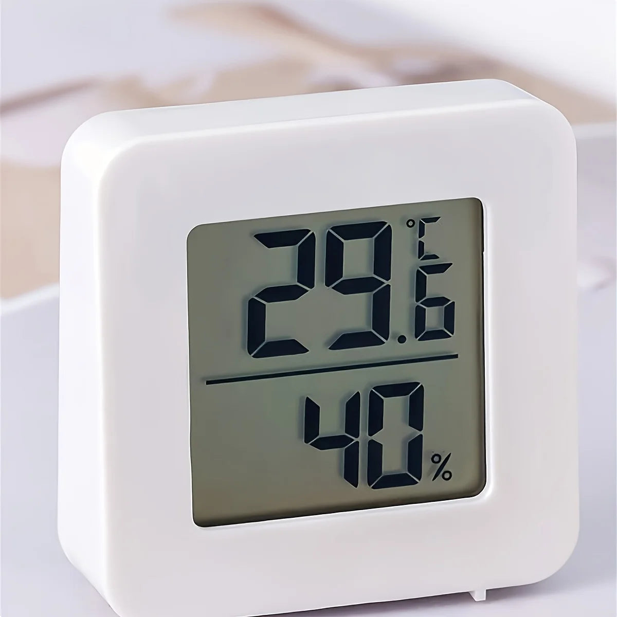 Prime Deal Zone indoor mini temperature and humidity meter with digital display, showing temperature and humidity levels.