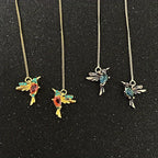 Hand-carved bird-shaped long tassel earrings for women with red and green synthetic zircon, featuring intricate banquet jewelry craftsmanship.