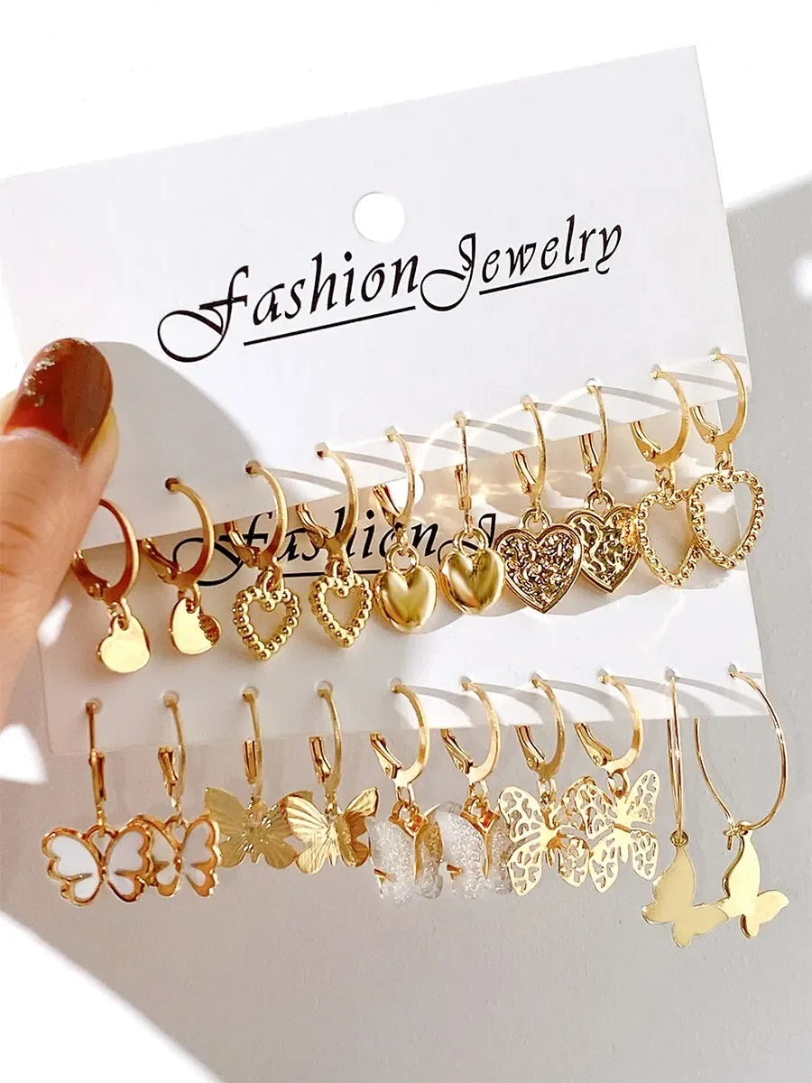 Set of 10 gold-colored creative earrings featuring butterfly and hollowed-out designs, perfect for women’s fashion jewelry.