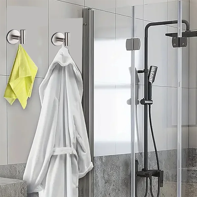 Stainless steel Prime Deal Zone bathrobe hook mounted on wall, holding towel, clothes, or hat in bathroom or kitchen.