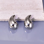 Gold hollow drop earrings for women, close-up detail