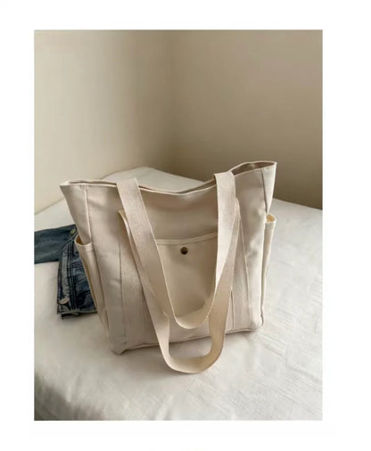 Prime Deal Zone HOMEFISH portable canvas shoulder bag with large capacity, versatile for students’ class and daily use.