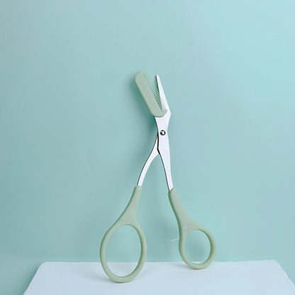 Pink stainless steel eyebrow trimming scissors with built-in comb from Prime Deal Zone for precise grooming and perfect eyebrows.