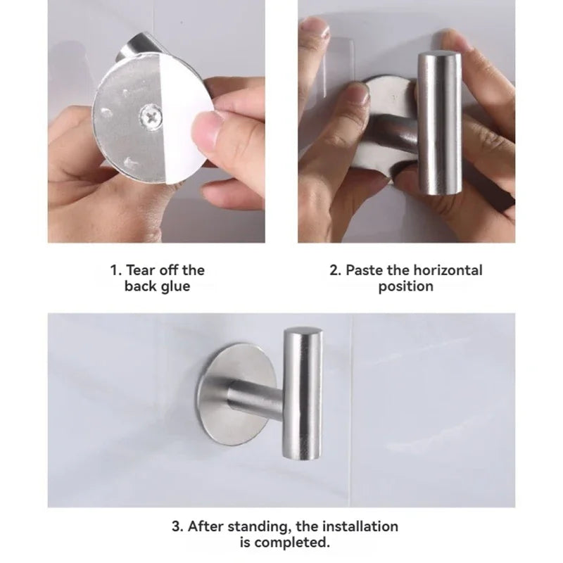 Stainless steel bathrobe hook by Prime Deal Zone mounted on bathroom wall, holding a towel and clothes in a modern bathroom setting.