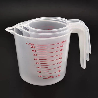 Set of three Prime Deal Zone plastic baking measuring cups with PVC scale, 250ml, 500ml, and 1000ml volume beakers for kitchen use.